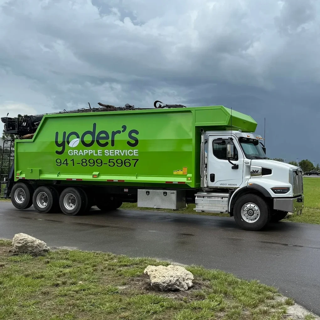 Grapple truck used for hauling by Yoders in Sarasota FL